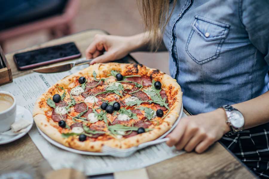 Girl eating pizza