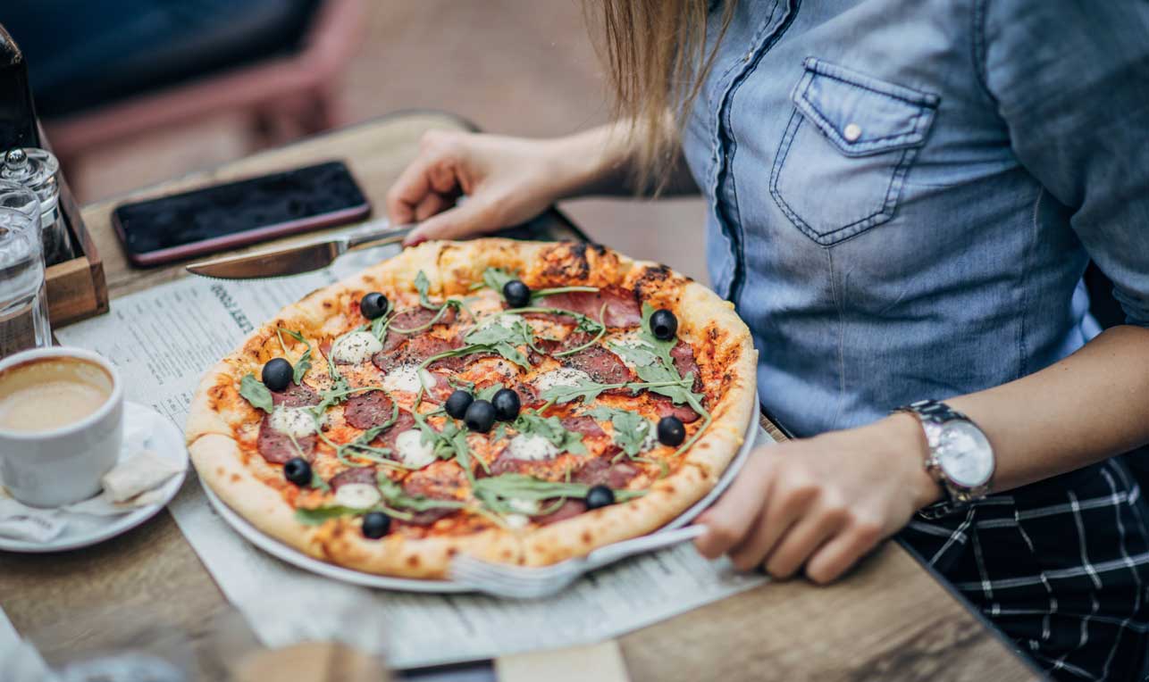 Girl eating pizza